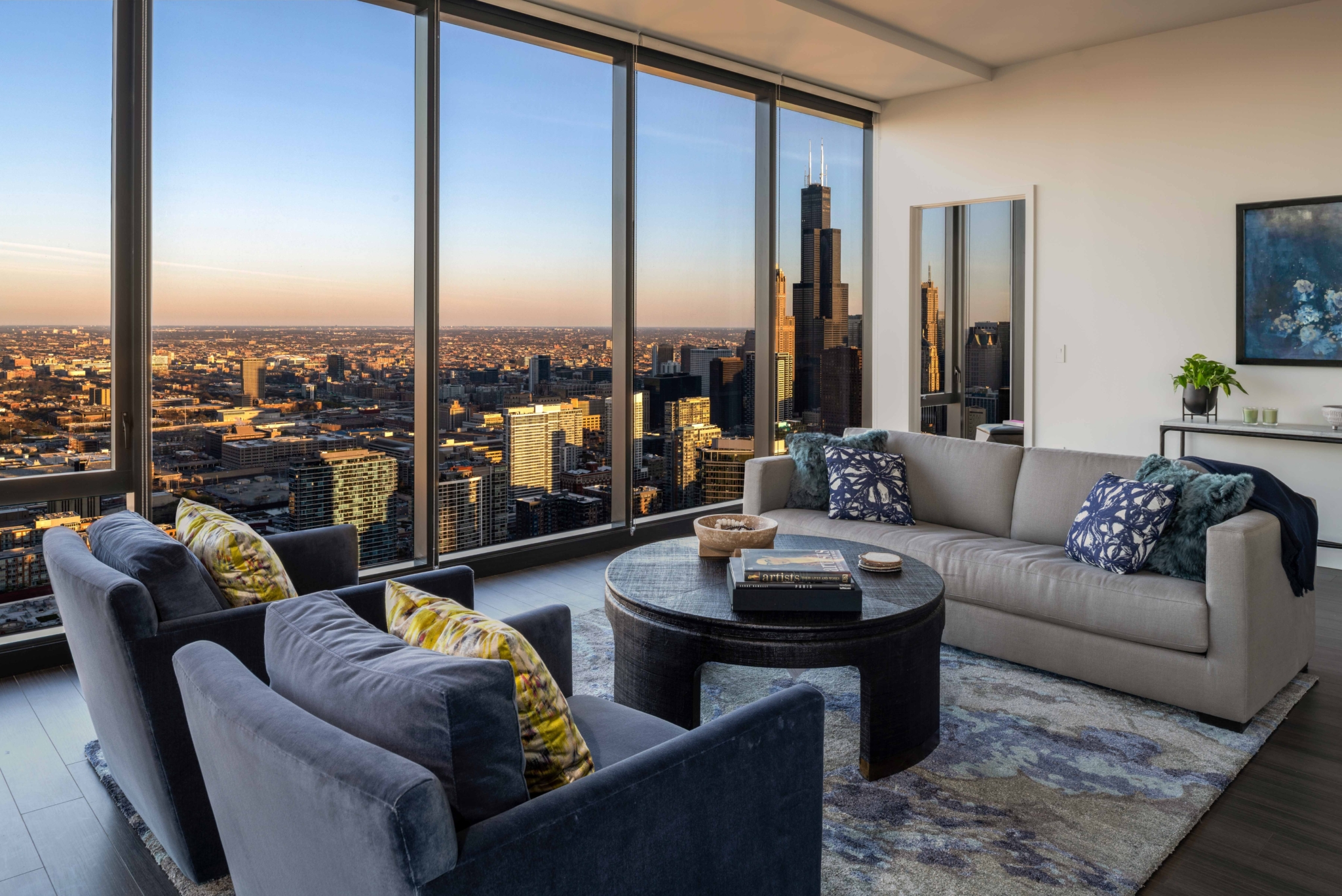 Penthouse residence living room with floor-to-ceiling skyline views