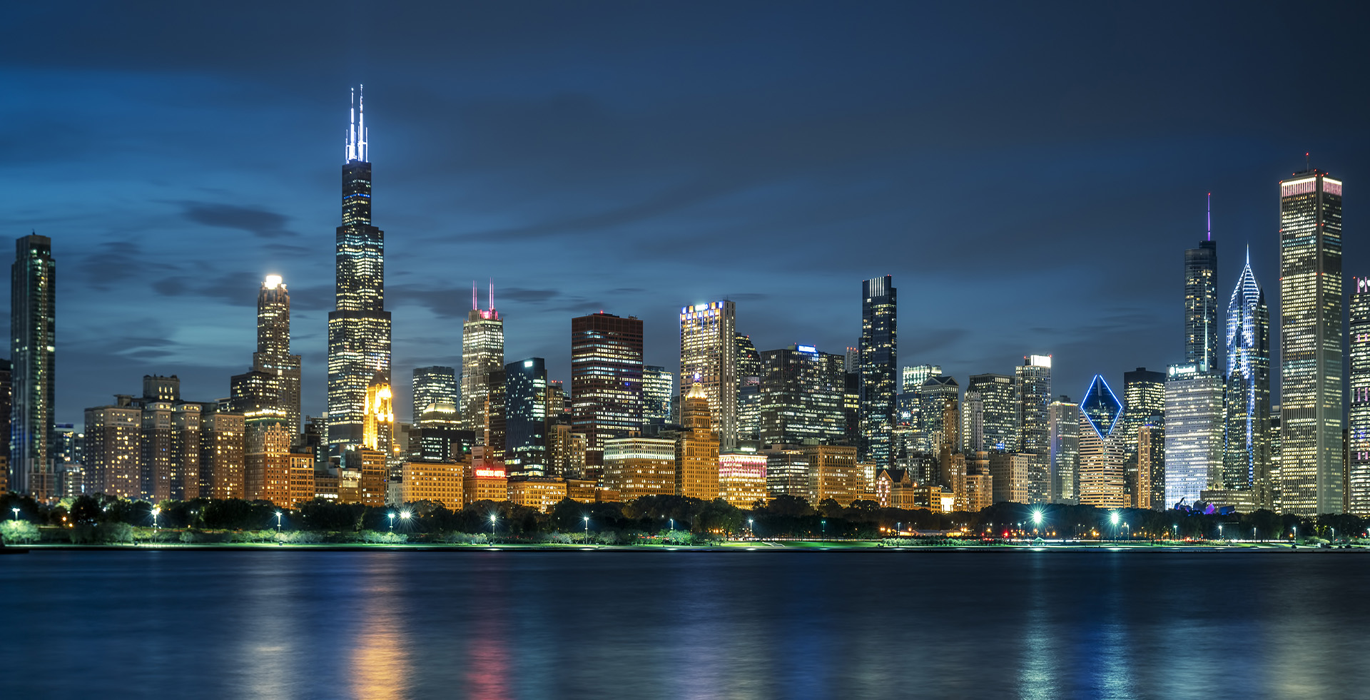 The downtown Chicago skyline at night across Lake Michigan